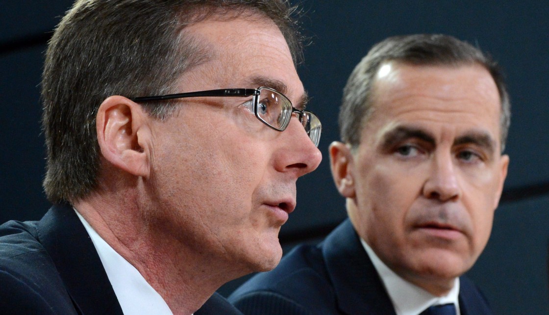 Bank of Canada Governor Mark Carney, right, looks towards Senior Deputy Governor Tiff Macklem during a press conference at the National Press Theatre in Ottawa on Wednesday, January 23, 2013.