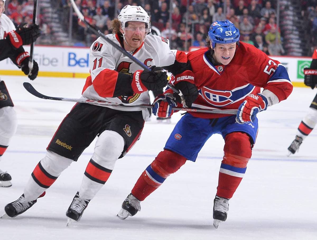 Ryan White #53 of the Montreal Canadiens and Daniel Alfredsson #11 of the Ottawa Senators battle for position during the NHL game on March 13, 2013 at the Bell Centre in Montreal, Quebec, Canada. (Photo by Francois Lacasse/NHLI via Getty Images).
