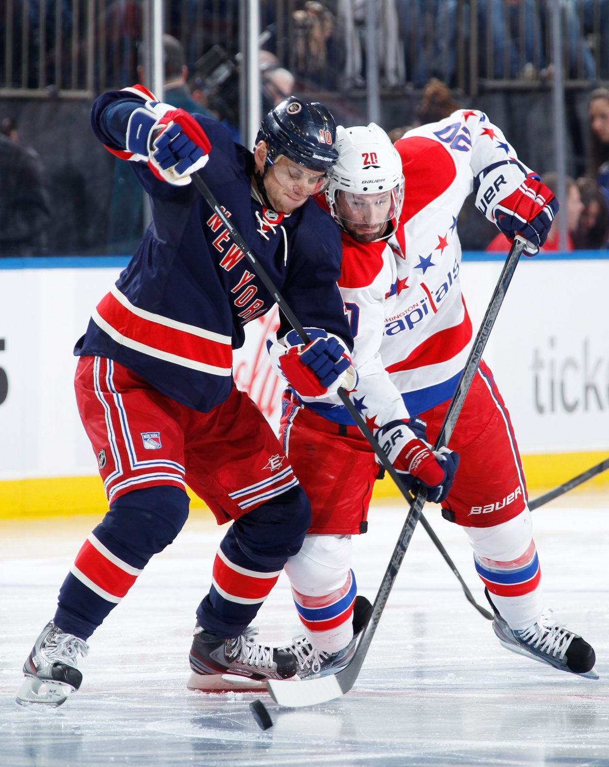 Marian Gaborik #10 of the New York Rangers and Troy Brouwer #20 of the Washington Capitals battle for the puck at center ice following a face-off at Madison Square Garden on March 24, 2013 in New York City. (Photo by Scott Levy/NHLI via Getty Images).