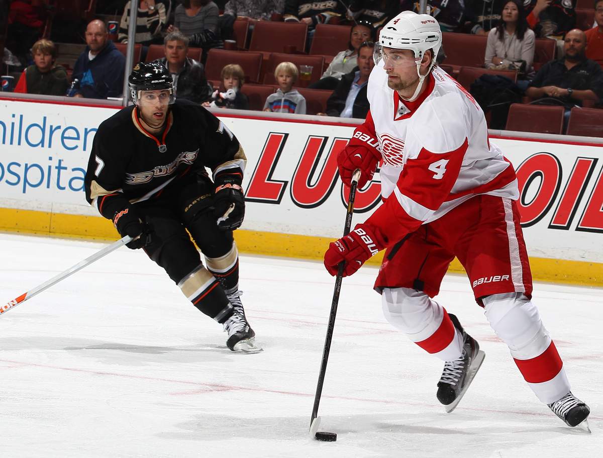 Jakub Kindl #4 of the Detroit Red Wings looks to take a shot as Andrew Cogliano #7 of the Anaheim Ducks positions to defend the play. March 24, 2013 at Honda Center in Anaheim, California. (Photo by Debora Robinson/NHLI via Getty Images).