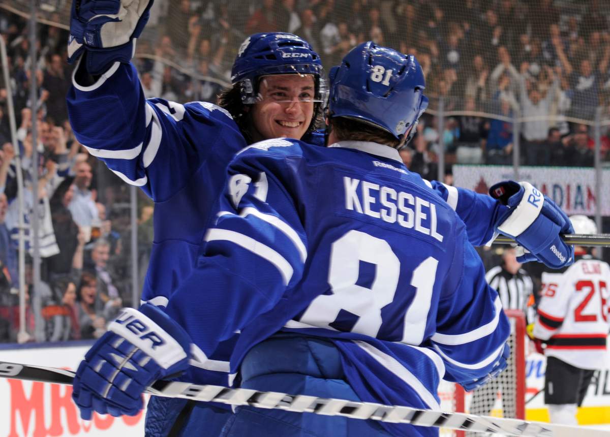 Tyler Bozak #42 and Phil Kessel #81 of the Toronto Maple Leafs celebrate a third period goal during NHL game action against the New Jersey Devils April 15, 2013 at the Air Canada Centre in Toronto, Ontario, Canada. 