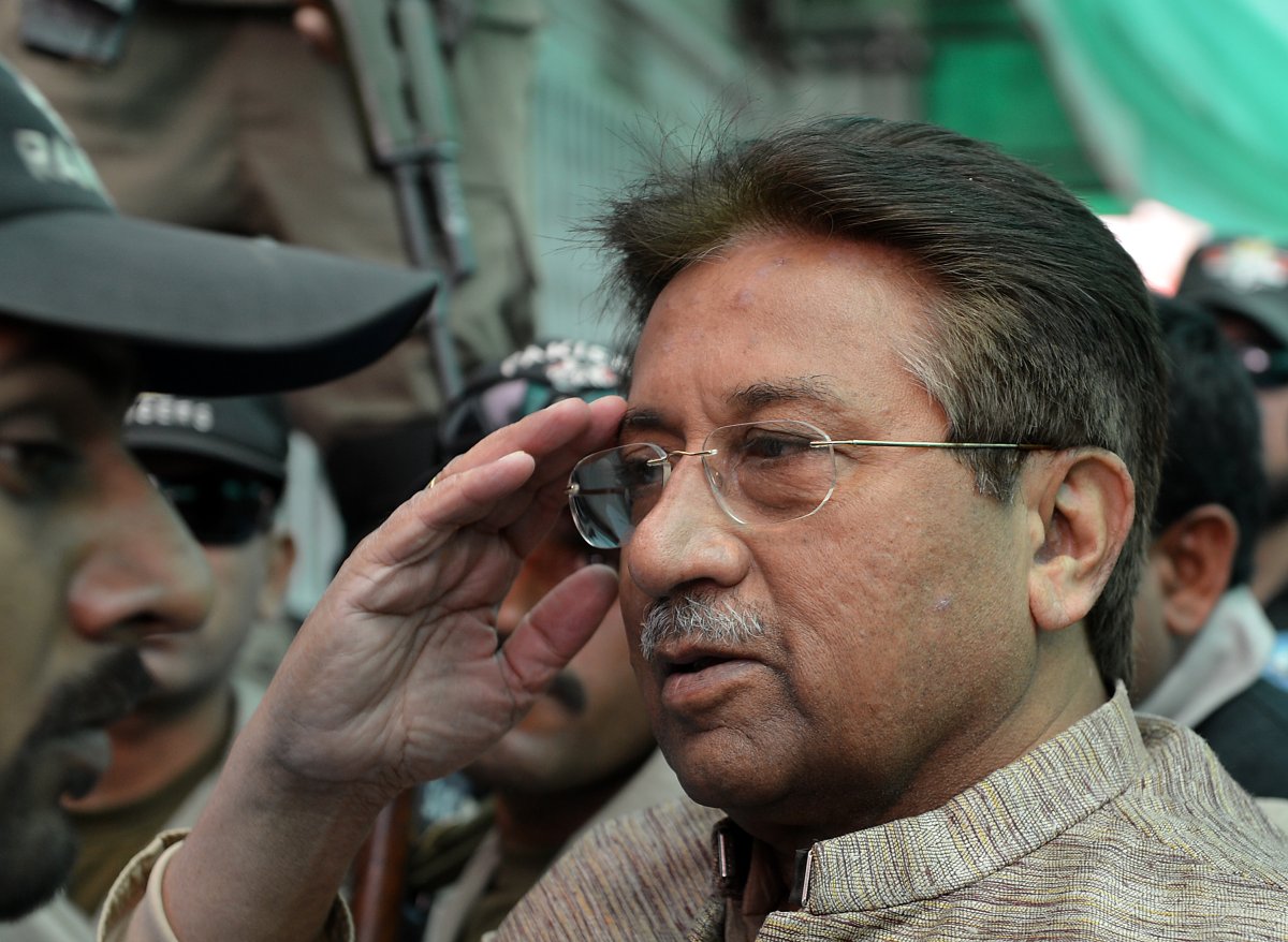 ormer Pakistani president Pervez Musharraf (C) is escorted by soldiers as he salutes on his arrival at an anti-terrorism court in Islamabad on April 20, 2013. 
