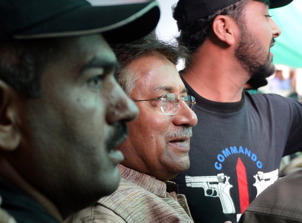 Former Pakistani president Pervez Musharraf (C) is escorted by soldiers and police commandos as he leaves an anti-terrorism court after a hearing in Islamabad on April 20, 2013. 