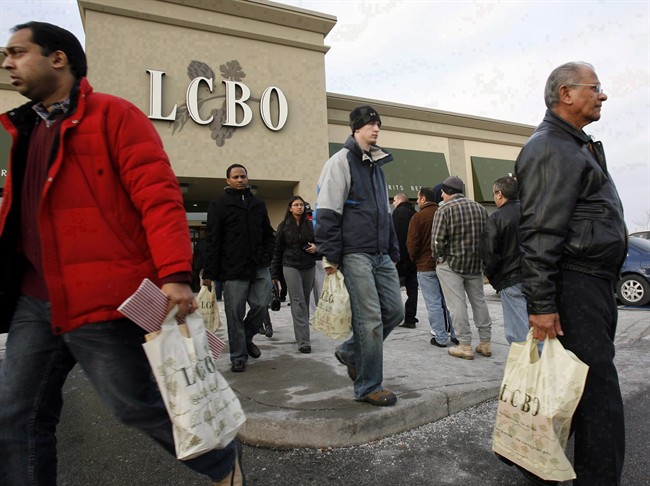 Patrons leave an LCBO store in Mississauga, Ont., December 31, 2007.