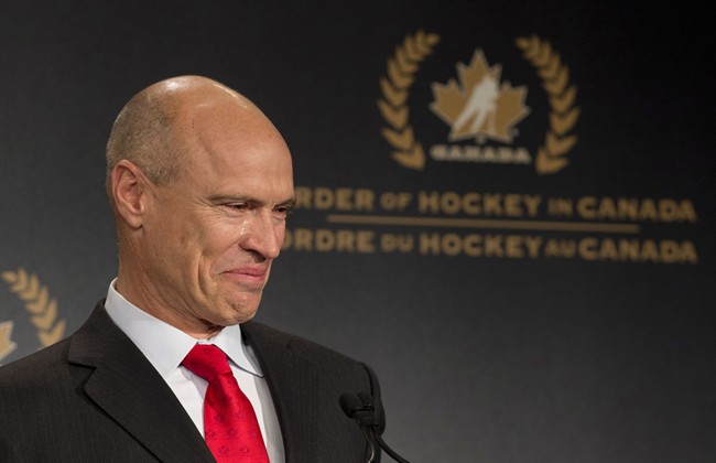 Tears roll down the cheek of former NHL great Mark Messier as he speaks during his induction into the Order of Hockey in Canada in Ottawa, Monday April 8, 2013.