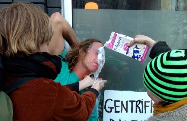 An anti-gentrification activist has his eyes washed out with milk after he was pepper-sprayed while protesting outside Pidgin restaurant in Vancouver's Downtown Eastside

.