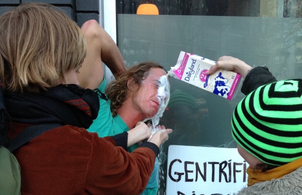 An anti-gentrification activist has his eyes washed out with milk after he was pepper-sprayed while protesting outside Pidgin restaurant in Vancouver's Downtown Eastside

.