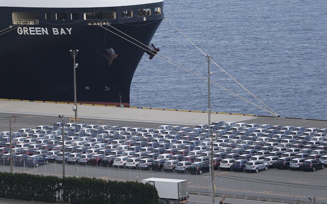 Cars for export are parked at a quay to be loaded on a freighter in Kawasaki, south of Tokyo, March 21, 2013.