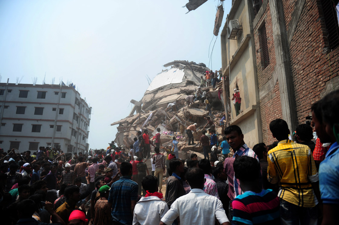 Bangladeshi volunteers and rescue workers assist in rescue operations 48 hours after an eight-storey building collapsed in Savar, on the outskirts of Dhaka, on April 26, 2013.  
