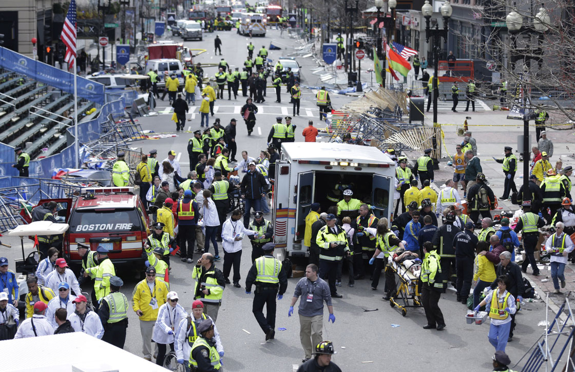Medical workers aid injured people at the finish line of the 2013 Boston Marathon following an explosion in Boston, Monday, April 15, 2013. 