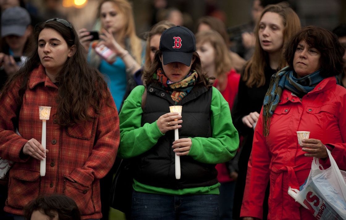 People gather in the Boston Commons for a candlelight vigil on April 16, 2013 in Boston, in the aftermath of two explosions that struck near the finish line of the Boston Marathon on April 15. 