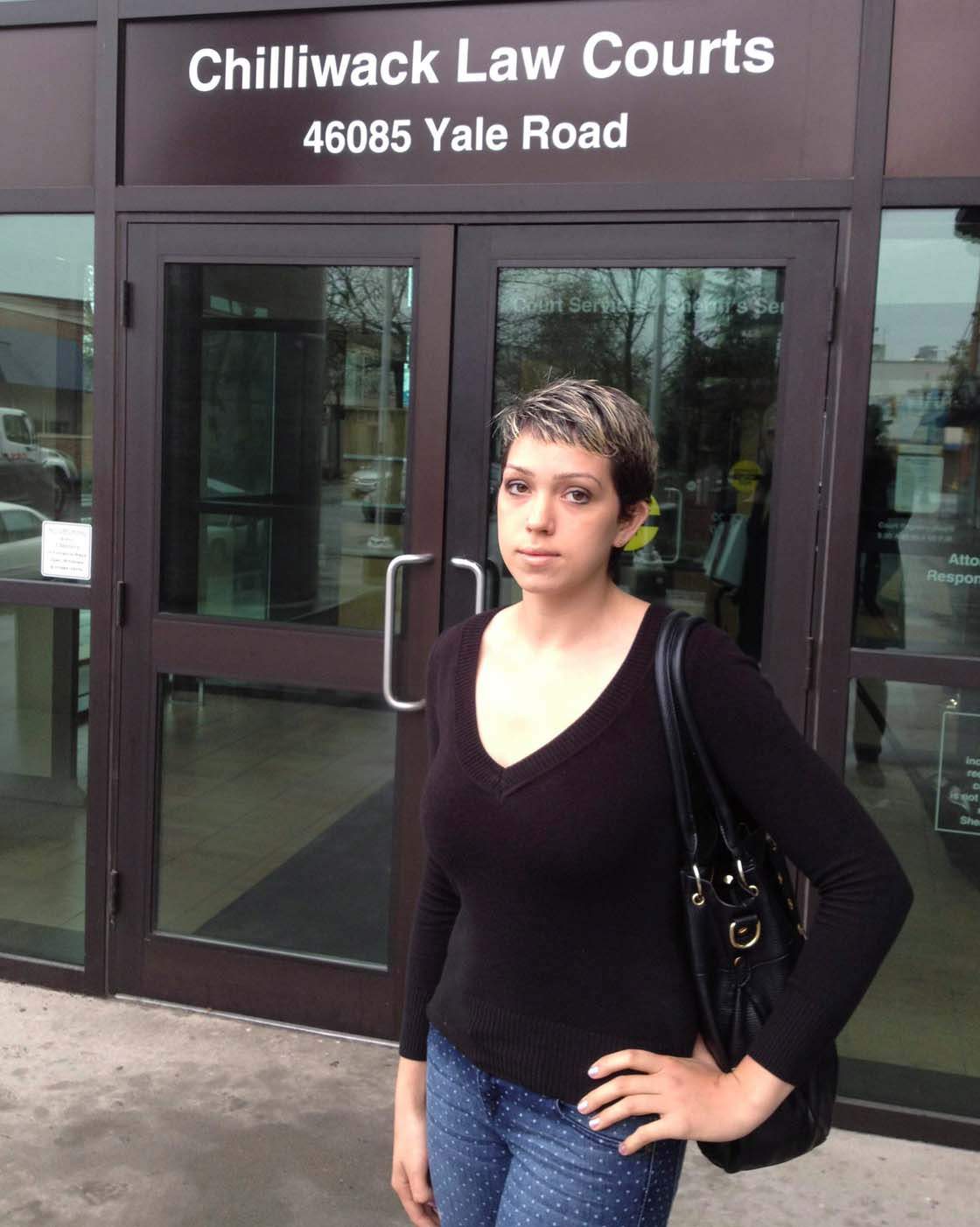 Twenty-four-year-old Stacy Bohun stands outside the court in Chillwack, B.C. on Wednesday, April 10, 2013 where she testified in the sexual assault trial of former BTO band member Tim Bachman. 