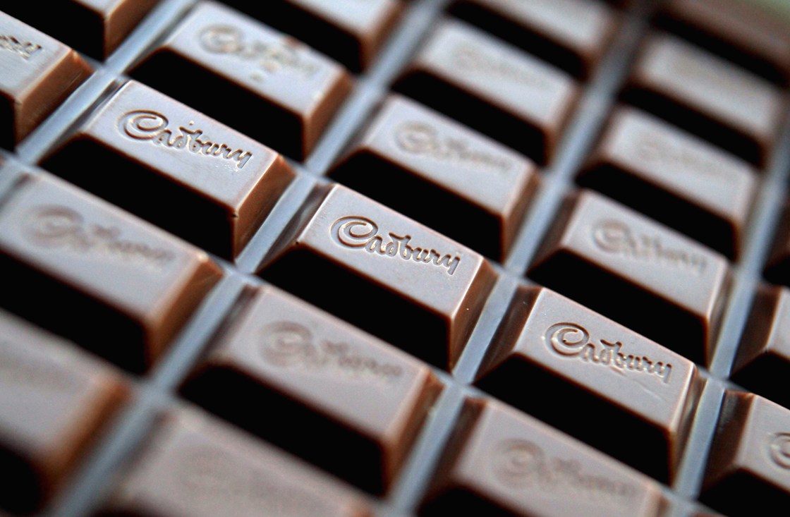In this photograph illustration a bar of Cadbury's Dairy Milk chocolate is seen on January 19, 2010 in Bristol, England.