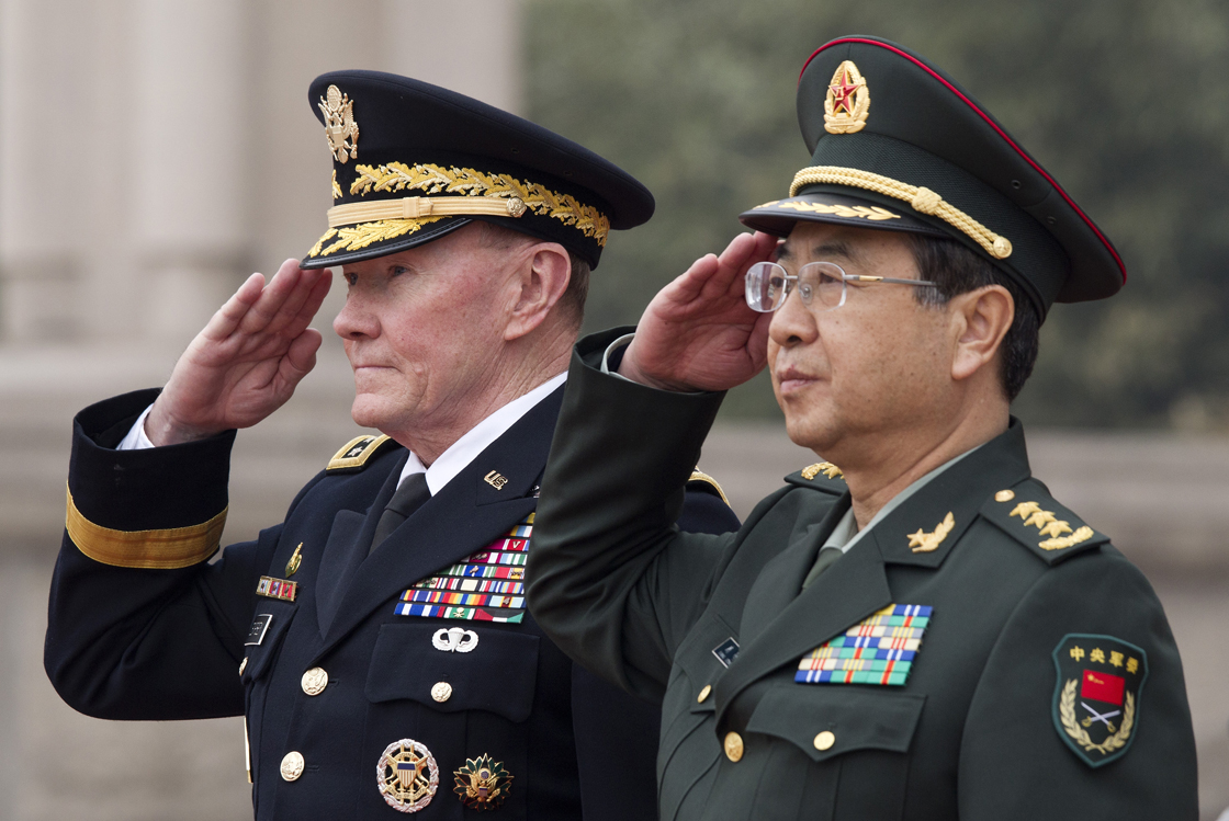 US military officer General Martin Dempsey (L) and his Chinese counterpart General Fang Fenghui salute at a welcoming ceremony at the Bayi Building in Beijing on April 22, 2013.   Dempsey paid a rare visit to China as the Pacific powers discuss concern over tensions with North Korea, the Pentagon. 