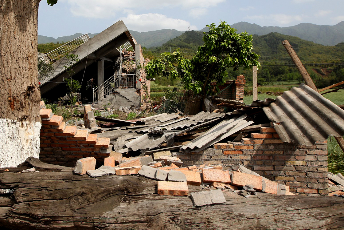 Damaged houses are seen in Longmen township, an area very close to the epicenter of a shallow earthquake at magnitude 7.0 that hit the city of Ya'an, southwest China's Sichuan province on April 20, 2013. More than 100 people were killed and 3,000 injured when a strong earthquake shook southwest China on April 20, wrecking homes and triggering landslides in an area devastated by a major tremor in 2008. 