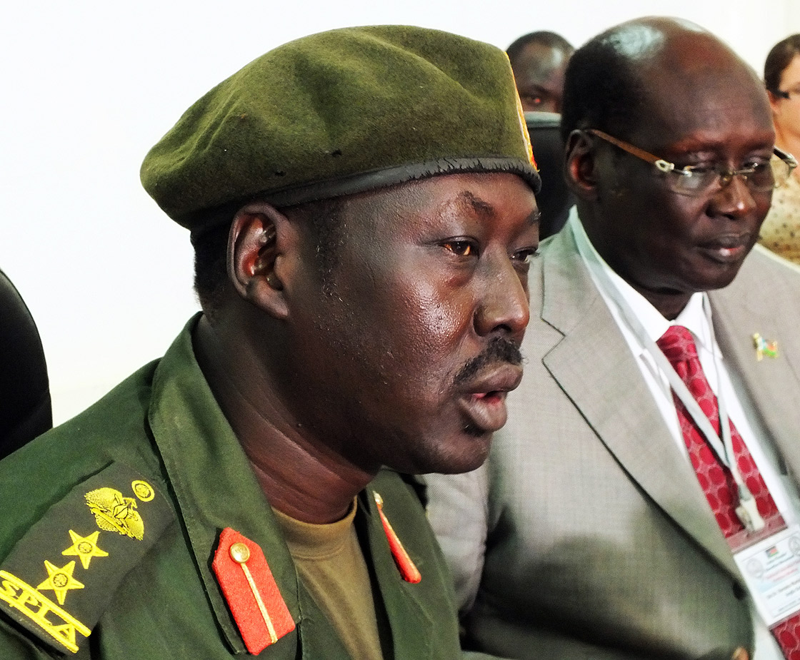 Sudan People's Liberation Army (SPLA) spokesman Colonel Philip Aguer (L) and South Sudan government spokesman, Barnaba Marial Benjamin (R) address the media during a press conference in Juba, South Sudan, on March 27, 2012. Aguer said five United Nations peacekeepers were killed when suspected rebels ambushed a U.N. convoy in a remote, violent state on April 9, 2013.