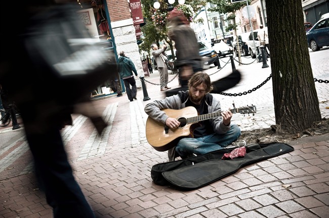 Kirk Caouette stars as Mike, the homeless busker in the film, "Hit 'n Strum," in this undated handout image. Four years ago, when former Vancouver film stuntman Kirk Caouette was looking to write a film based on a story in his own backyard, he came across well-known homeless street busker Andre Girard playing his guitar and singing for passersby. 
