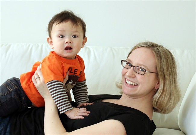 First-time mom Michelle Delhaere is pictured with her seven-month-old son Henry at their home in Ottawa, Saturday March 23, 2013.