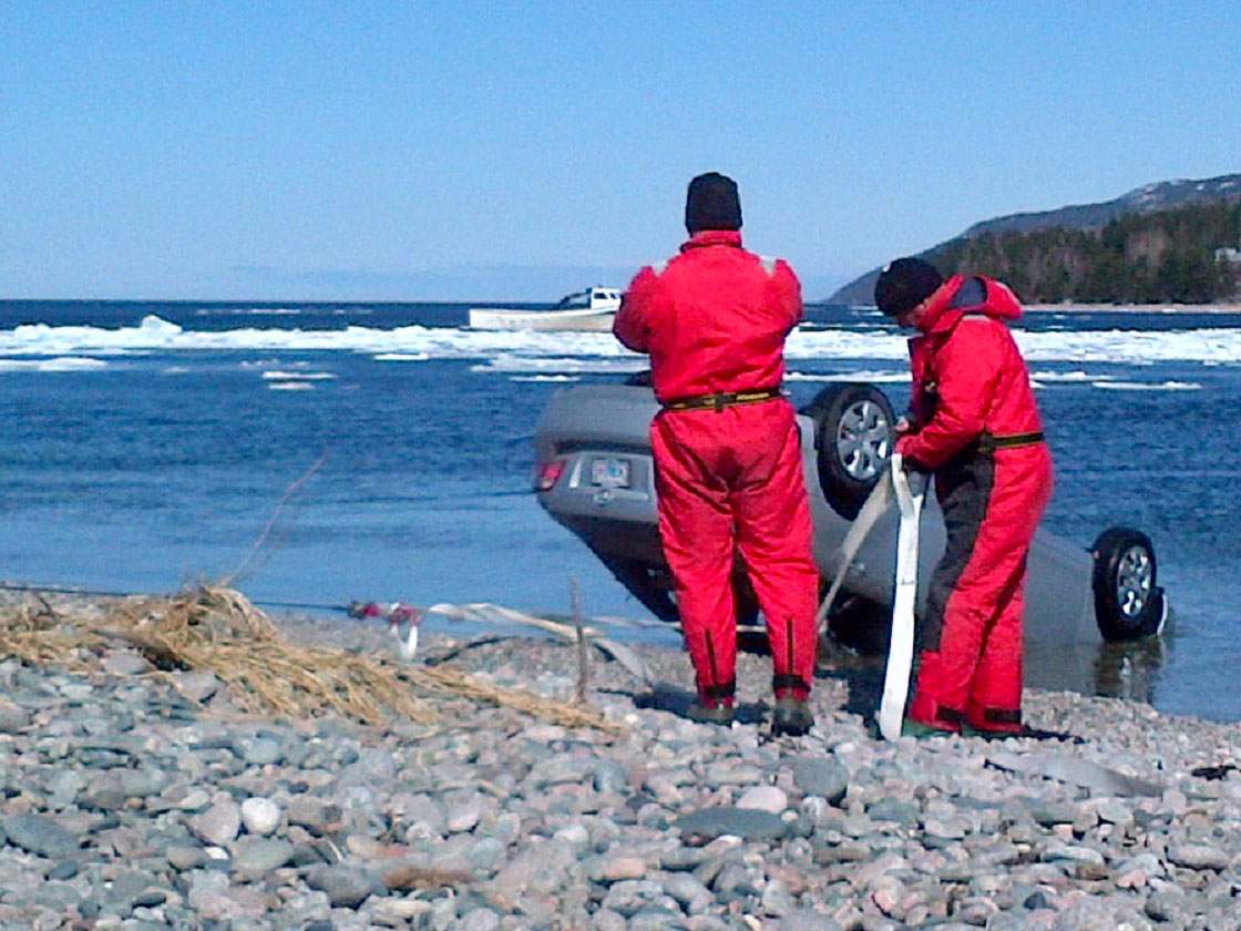 Divers pull the car that drove off the Englishtown Ferry last month out of the water. Police identified missing man Jerry Hengeveld, 81, as the driver.
