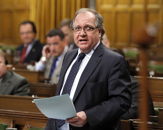 File - Aboriginal Affairs Minitser Bernard Valcourt stands in the House of Commons during Question Period on Parliament Hill, in Ottawa, Friday April 19, 2013.