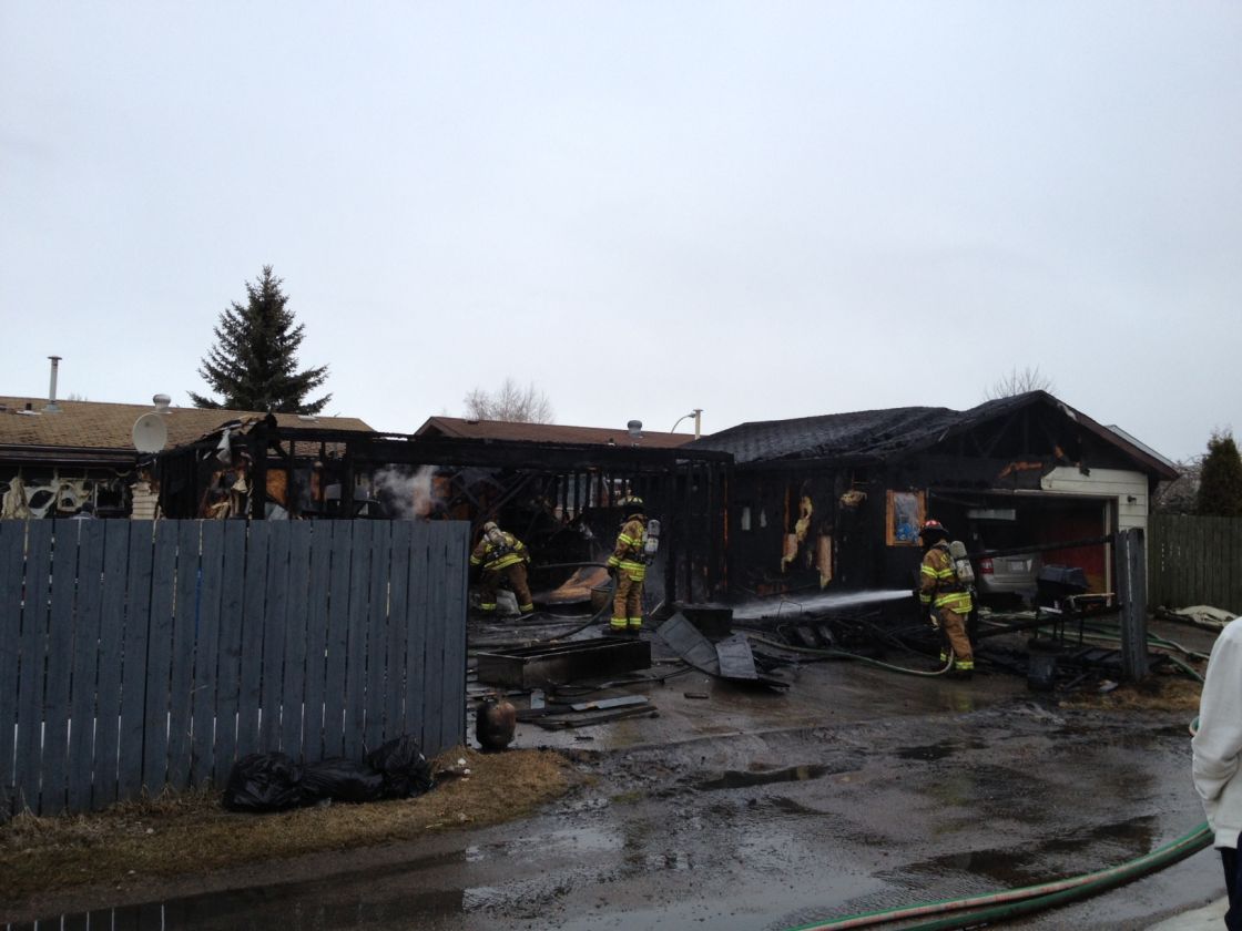 Two garages were destroyed in a fire in the area of 103rd Street and 168th Avenue Wednesday, April 24, 2013.