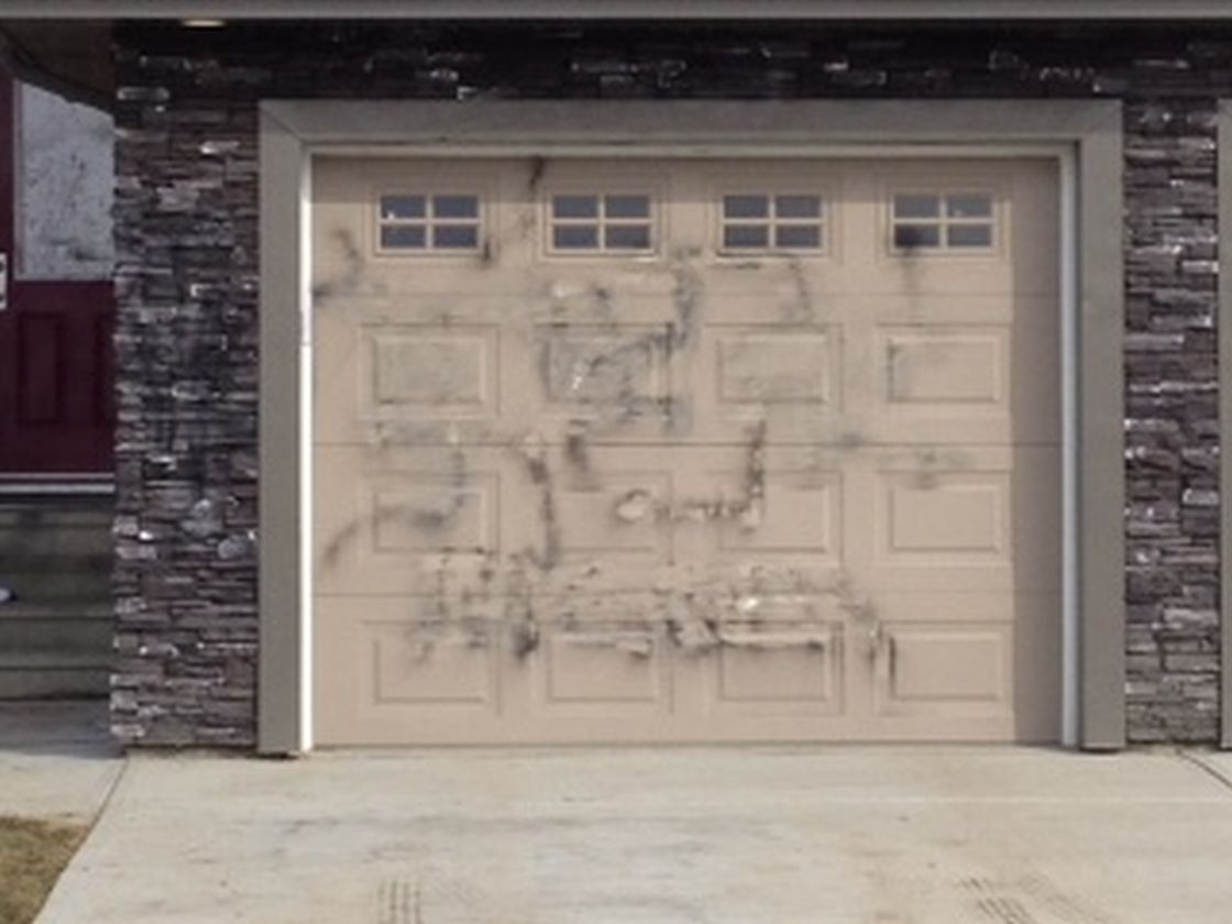 Police are investigating after disturbing graffiti was found on this souteast Edmonton home. 