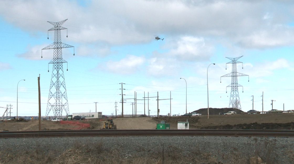 A helicopter being used to string rope from tower to tower, flies near Highway 16 and Anthony Henday east, Sunday, April 21, 2013. 