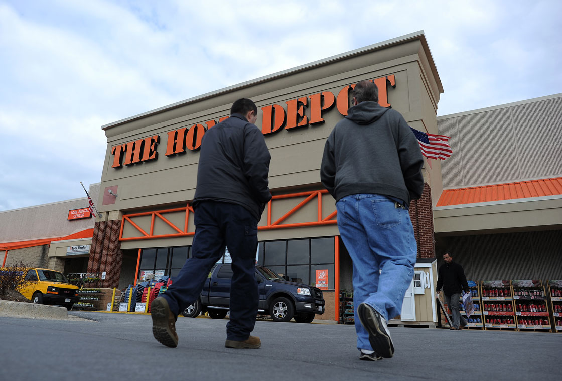Shoppers walk towards a Home Depot store in Silver Spring, Maryland, on March 28. 2013. 