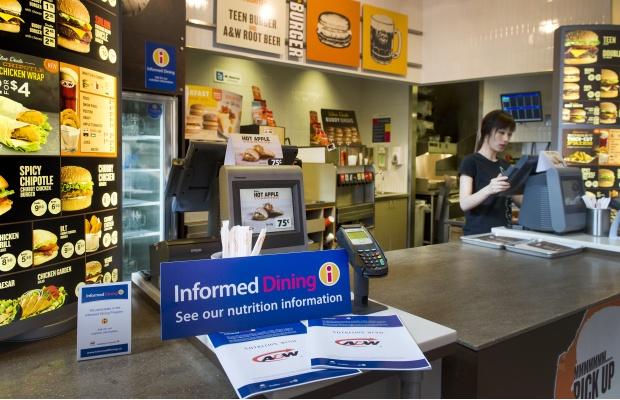 A&amp;W server Yoult Ahn with an Informed Dining program brochure at the Granville and Cordova restaurant in Vancouver on Wednesday, April 3, 2013. 