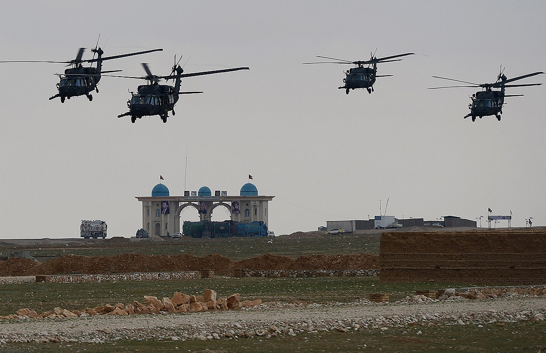 NATO-led International Security Assistance Force (ISAF) helicopters fly over the city of Mazar-i-Sharif on March 23, 2013.