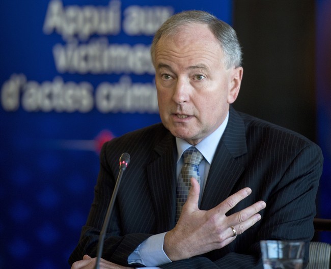 Minister of Justice Rob Nicholson answers questions from reporters following his address in Ottawa on Tuesday, April 23, 2013 at the consultation for the creation of a Canadian Victims Bill of Rights.