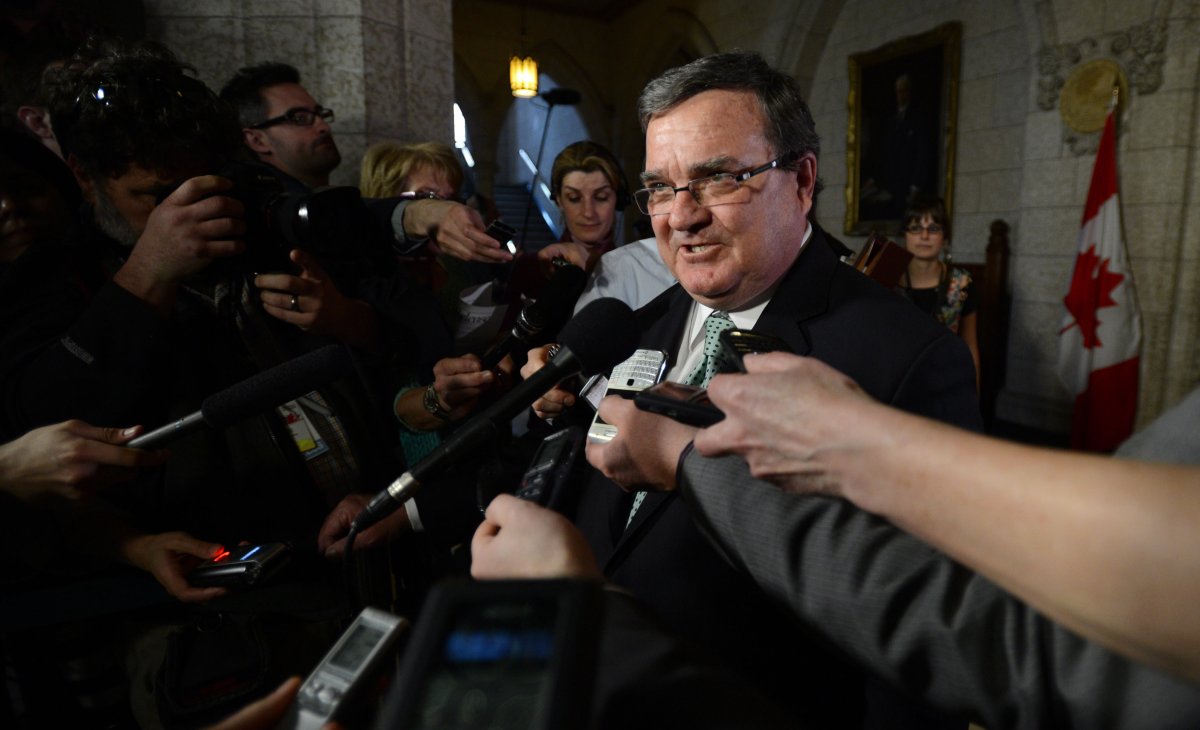Finance Minister Jim Flaherty speaks to reporters in the foyer of the House of Commons on Parliament Hill in Ottawa on Monday, April 29, 2013. 