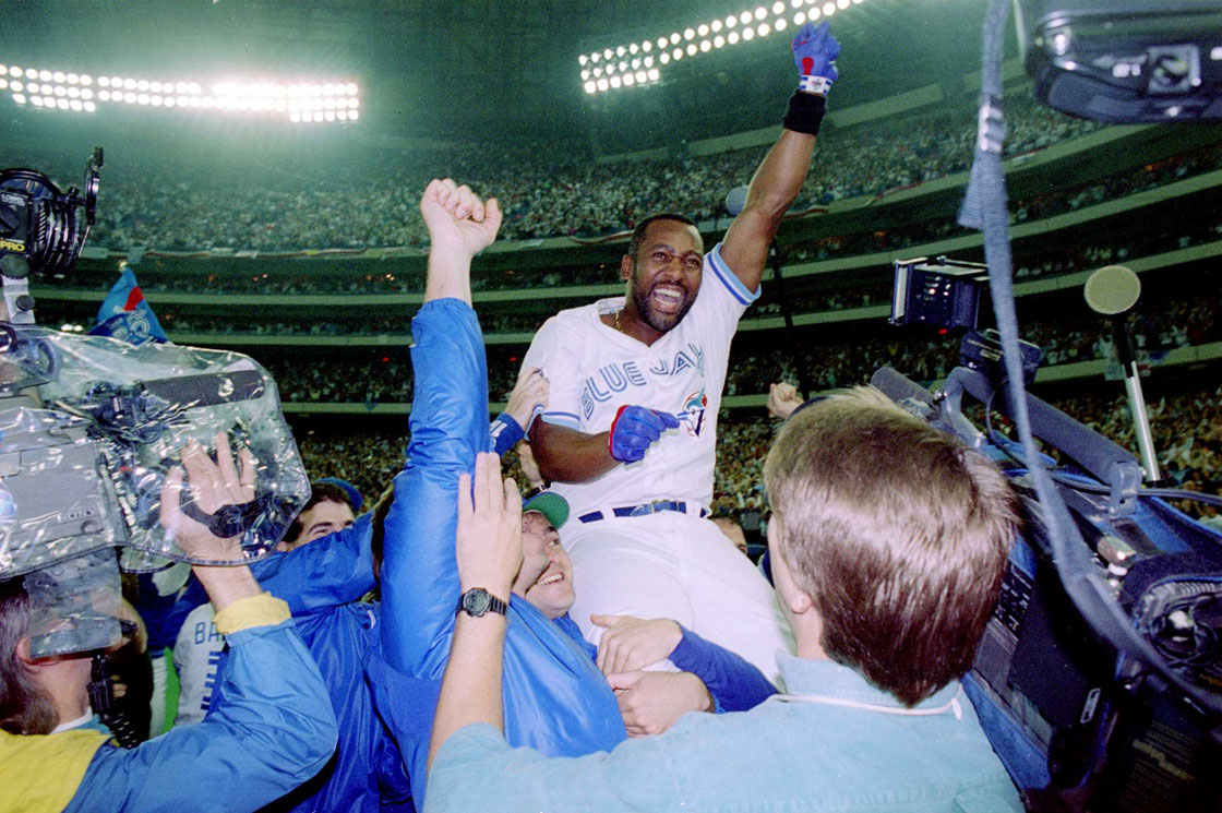 Joe Carter of the Toronto Blue Jays is held aloft after hitting a three-run homer in the bottom of the ninth to win the World Series, four games to two, against the Philadelphia Phillies on October 23, 1993 at the Toronto Skydome.  