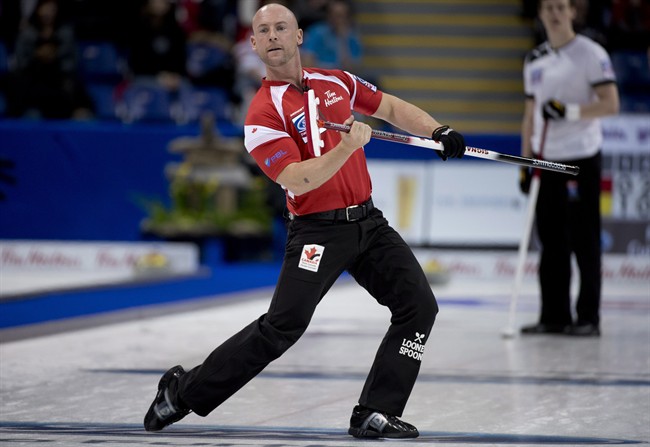 Canada's Ryan Fry celebrates his shot during a page 3-4 playoff draw against Denmark at the World Men's Curling Championship in Victoria, B.C., Saturday, April 6, 2013. 
