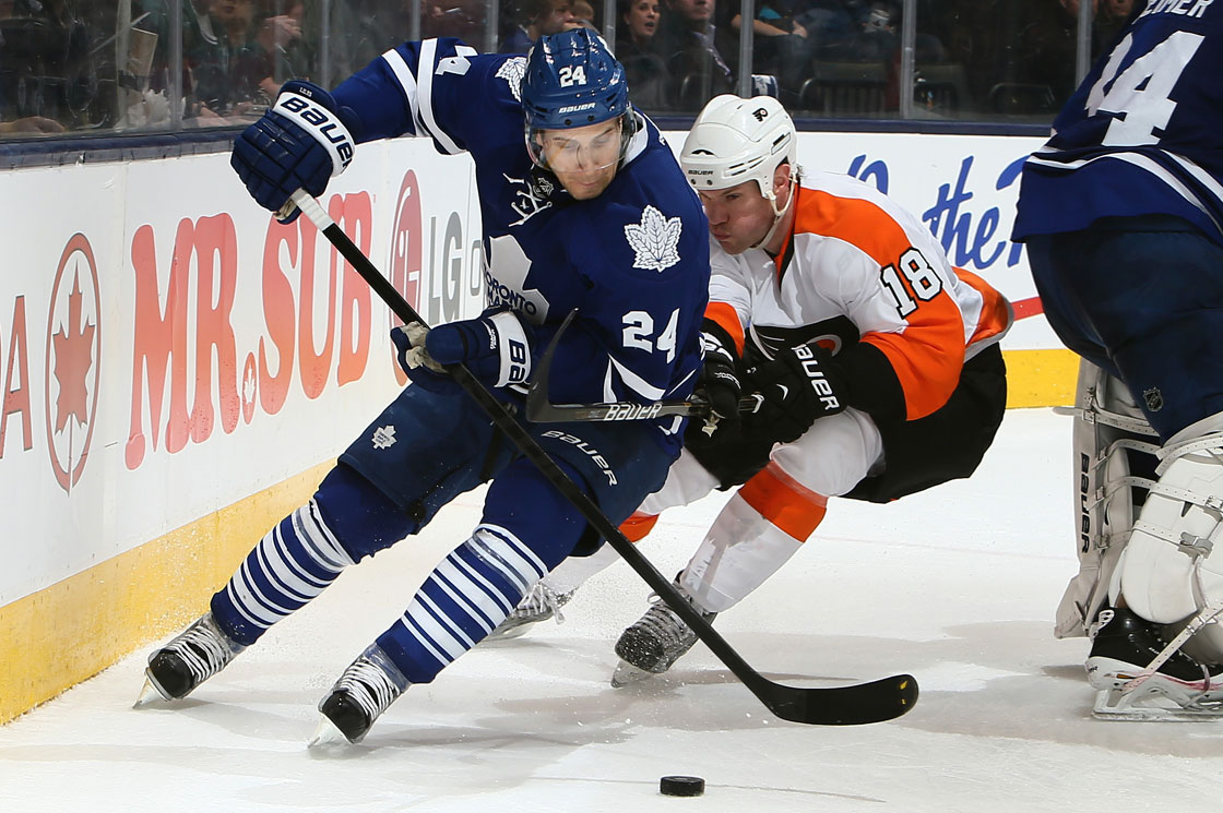 John-Michael Liles of the Toronto Maple Leafs gets away from Adam Hall of the Philadelphia Flyers during NHL action at the Air Canada Centre April 4, 2013 in Toronto. 