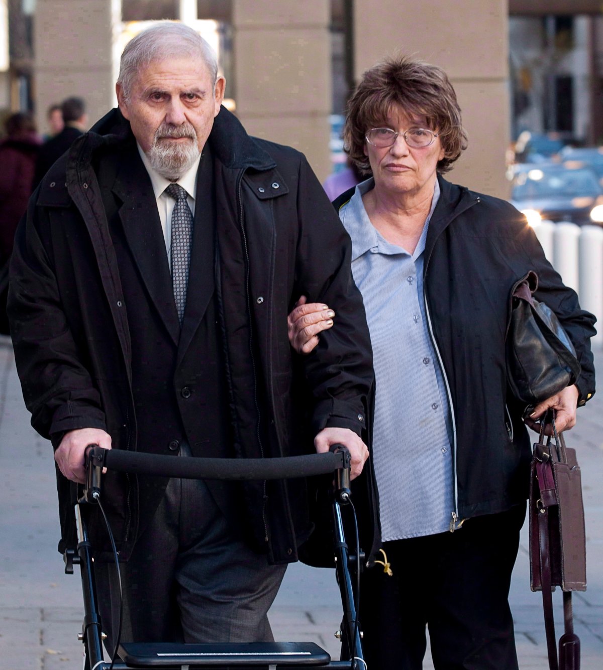 Dr. Aubrey Levin, left, leaves court in Calgary on Monday, Oct. 15, 2012 with his wife Erica. 