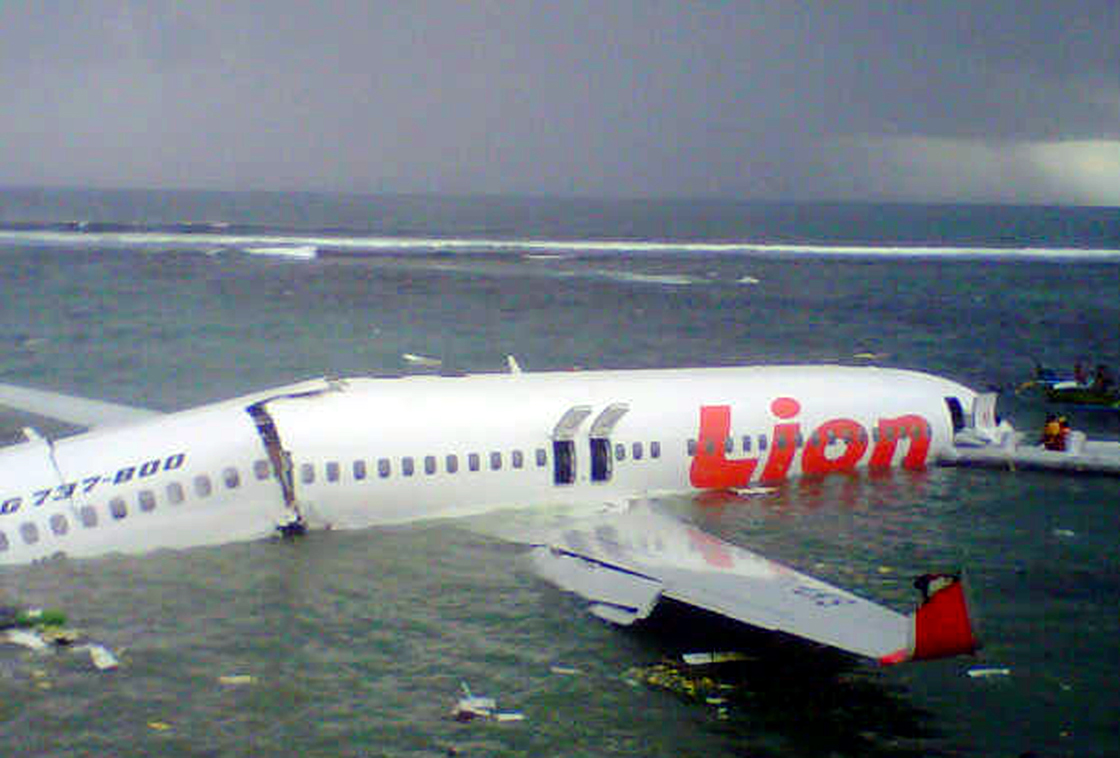 This handout photo released by the Indonesian Search And Rescue Agency (SAR) on April 14, 2013 shows a Lion Air Boeing 737 lying submerged in the water after missing the runaway during landing at Bali's international airport near Denpasar. 