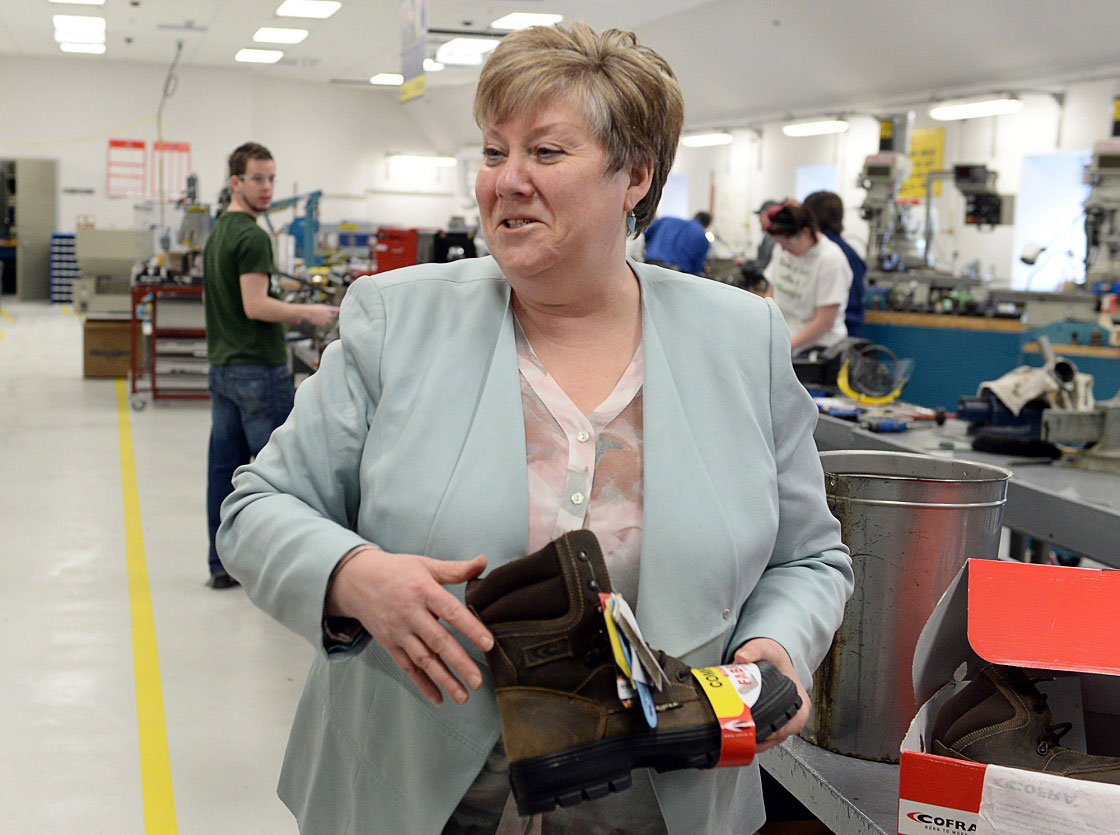 Maureen MacDonald holds a pair of work boots as she visits the industrial mechanical program at the Nova Scotia Community College in Halifax on April 3, 2013.
