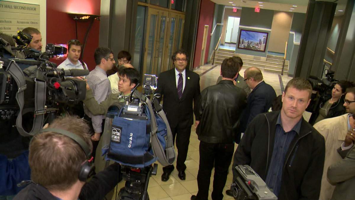 Mayor Naheed Nenshi speaks to reporters at city hall.