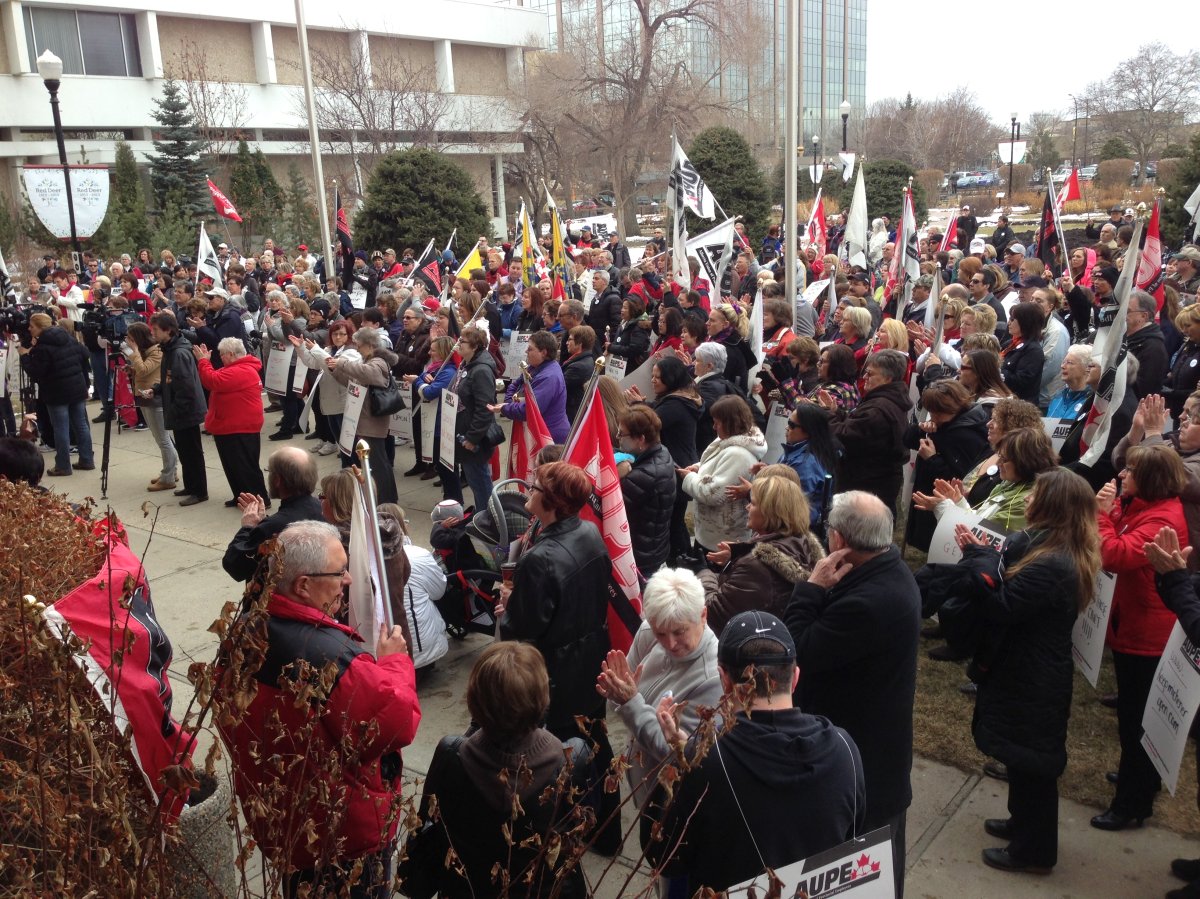 Dozens of people gather outside Red Deer's city hall  to protest plans to shut down the care facility.