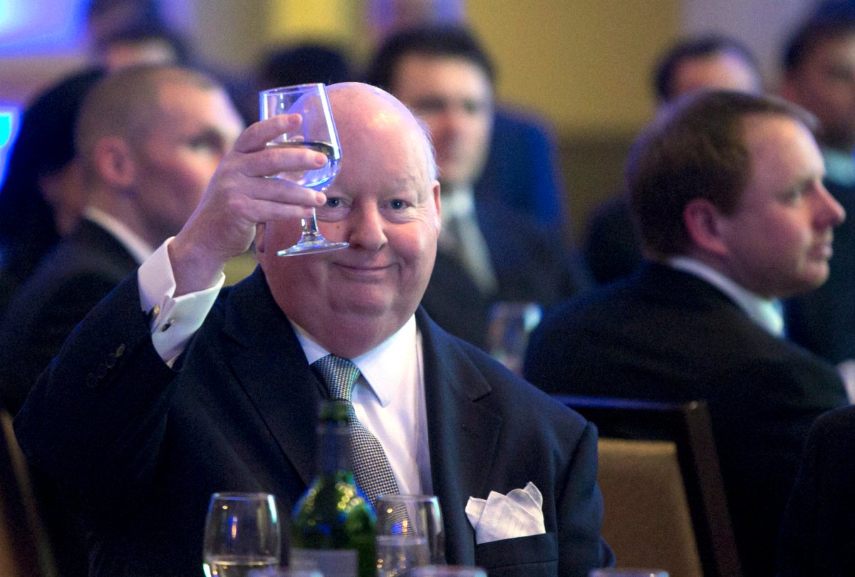 Senator Mike Duffy holds up his glass during the Maritime Energy Association's annual dinner in Halifax on Wednesday, Feb. 6, 2013.