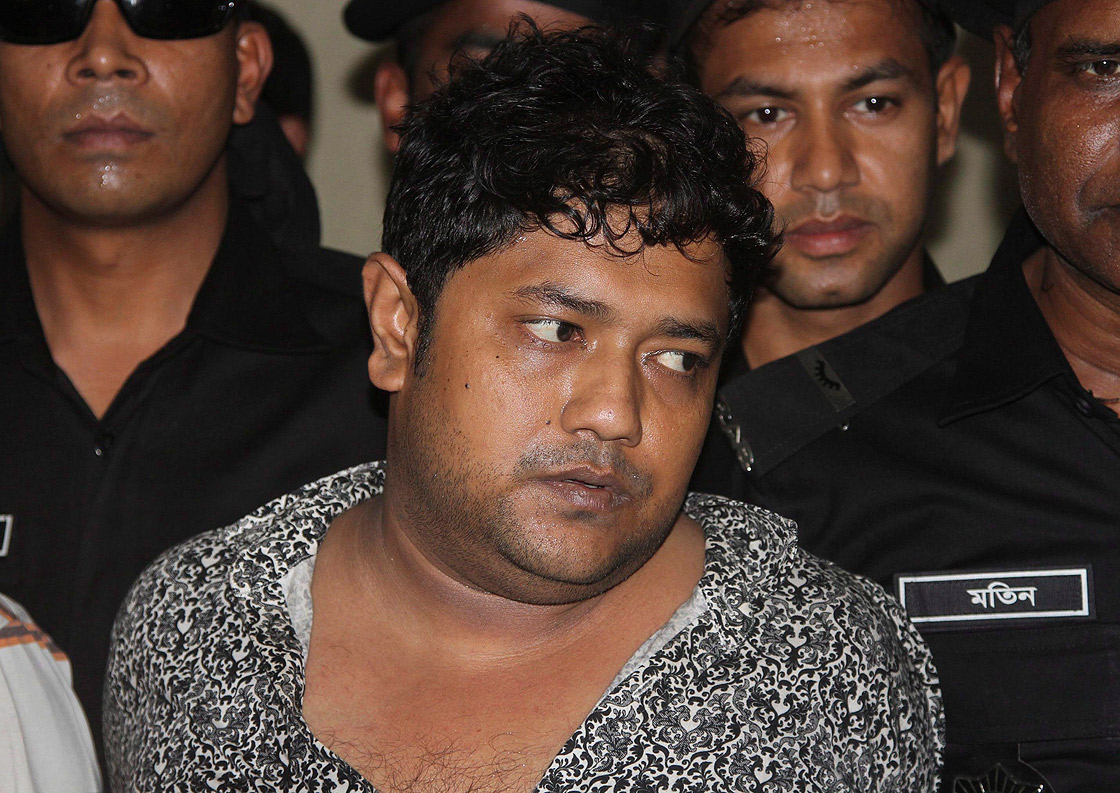Mohammed Sohel Rana, the fugitive owner of an illegally-constructed building that collapsed last week in Bangladesh, killing some 377 people, is paraded by Rapid Action Battalion commandoes for the media along with unidentified alleged accomplices, not pictured, in Dhaka, Bangladesh, Sunday, April 28, 2013.