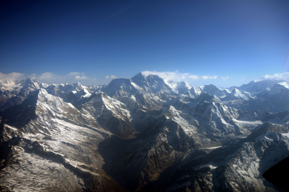 This photograph taken from an aircraft shows an aerial view of Mount Everest (C) and The Himalayan mountain range, some 140kms north-east of Kathmandu on April 3, 2013. 