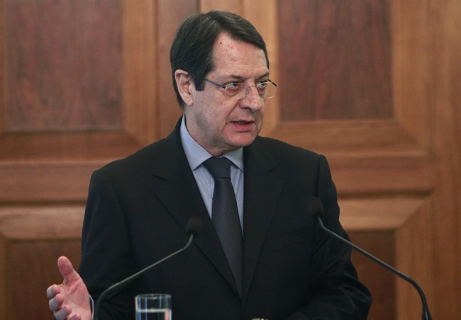 Cyprus' President Nicos Anastasiades, talks during the oath of office ceremony of a new Finance Minister Harris Georgiades, unseen, at the Presidential Palace the Cypriot capital Nicosia, on Wednesday, April 3, 2013.