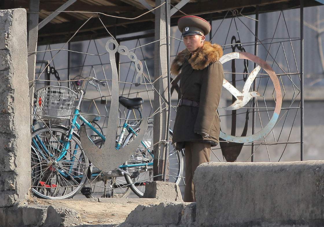 This picture taken on April 14, 2013 shows a North Korean soldier patrols along the bank of the Yalu River in the North Korean town of Sinuiju across from the Chinese city of Dandong. 