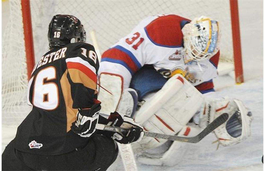 Cody Sylvester is stopped by goalie Laurent Brossoit in Game 2 of the WHL Eastern Conference final between the Edmonton Oil Kings and the Calgary Hitmen at Rexall place in Edmonton, April 19, 2013.