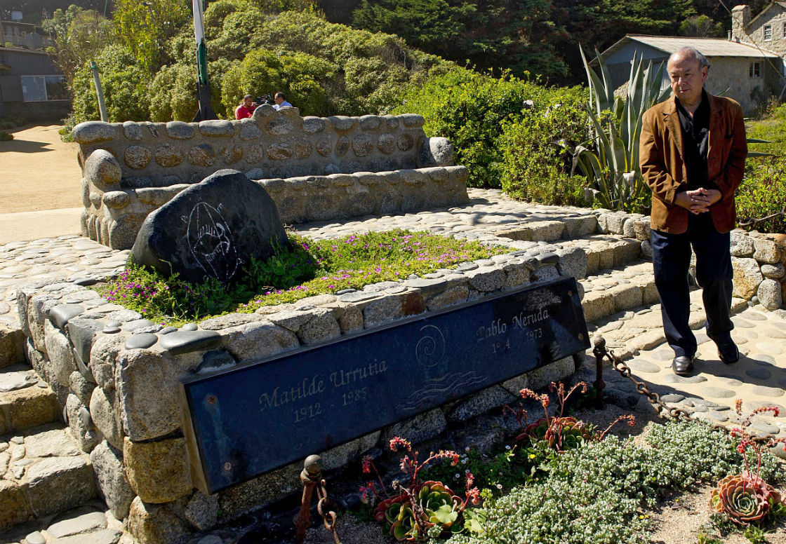 Rodolfo Reyes, nephew of Chilean poet Pablo Neruda, is seen next to his uncle´s tomb in Isla Negra, some 120 km (75 miles) west of Santiago, on April 7, 2013. 