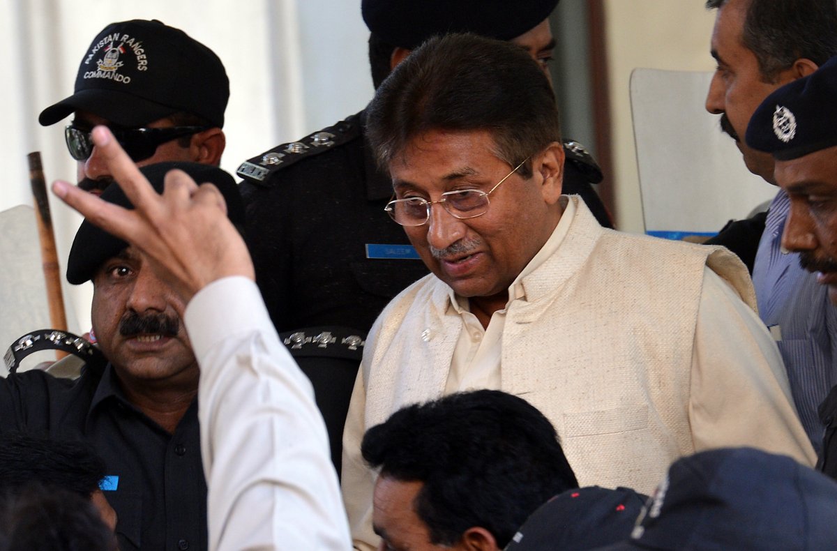 Former Pakistani president Pervez Musharraf (C) is escorted by security personnel as he leaves the Pindi High Court after a hearing in Rawalpindi on April 17, 2013.