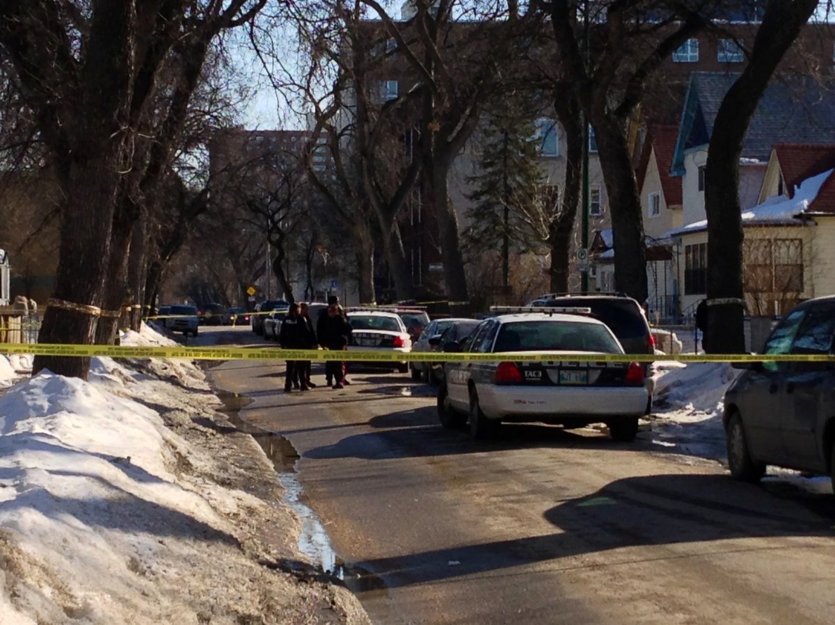 Police investigate the shooting on Langside Street on Tuesday.