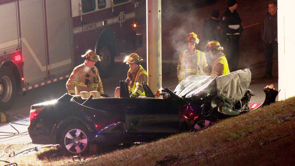 Firefighters investigate a crash on the off-ramp from northbound Deerfoot Trail onto westbound Memorial Drive.